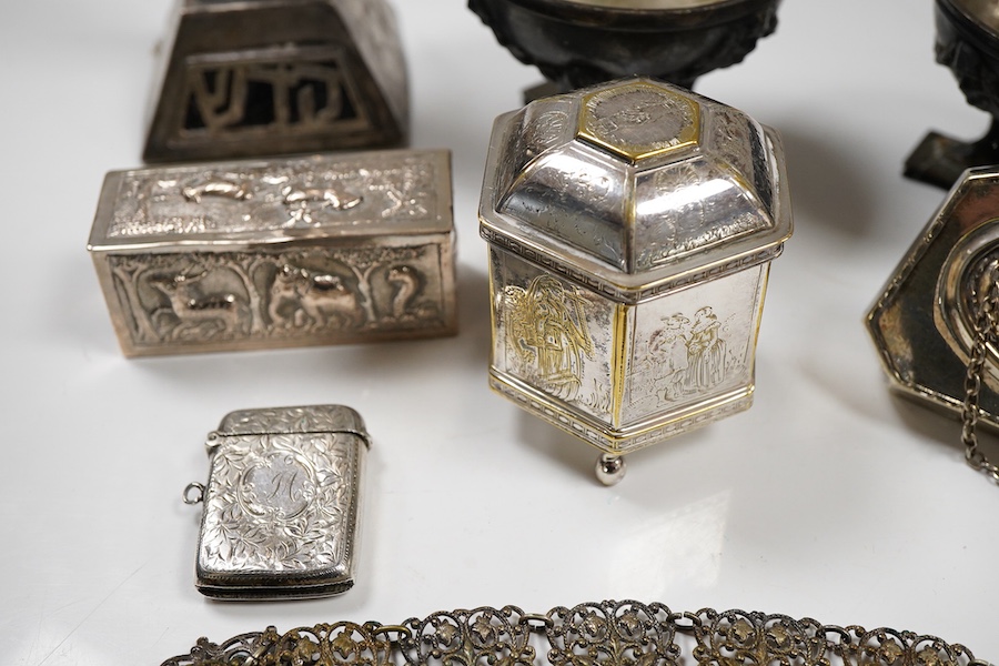An Edwardian silver vesta case, Birmingham, 1902, 42mm, together with a small Indian white metal box, a pair of white metal Soviet? candlesticks, a plated purse, a plated belt, a hexagonal box and cover stamped MMA and a